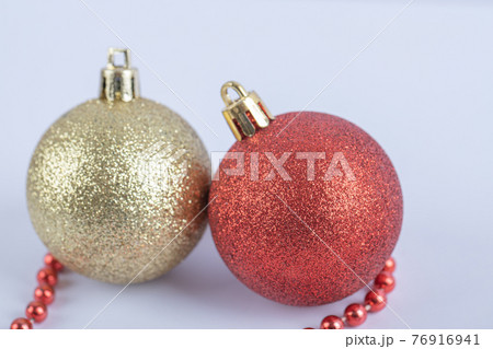 Christmas tree balls with red pearl chain on the white background 76916941