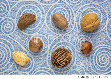 variety of nuts in shells 76919269