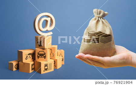 Money bag, stack of boxes and email internet symbol. Online Internet distribution of goods. E-commerce. Network marketing advertising. Remote non-contact trade services. Economic reorientation 76921904