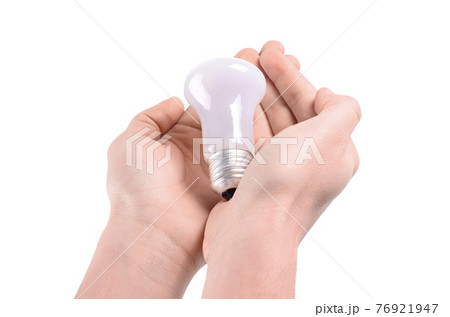 Bulb in hands on a white background Bulb in hands on a white background 76921947
