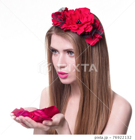 beautiful blonde woman looking rose petals in her hands beautiful blonde woman looking rose petals in her hands 76922132