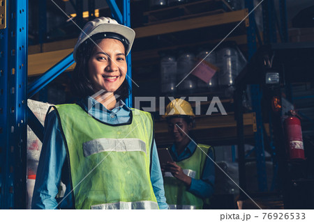 Portrait of young Asian woman warehouse worker smiling in the storehouse 76926533