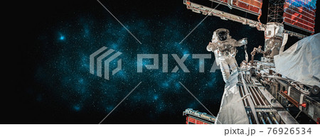 Astronaut spaceman do spacewalk while working for space station 76926534
