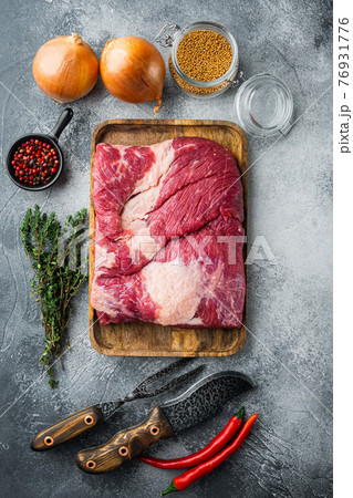 Raw brisket beef cut. Black Angus beef,with ingredients for smoking making barbecue, pastrami, cure, on gray stone background, top view flat lay 76931776