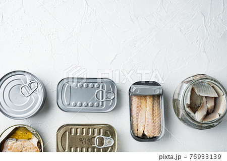 Assortment of cans of canned with different types of fish, on white background, top view flat lay, with copyspace and space for text Assortment of cans of canned with different types of fish, on white background, top view flat lay, with copyspace and space for text 76933139