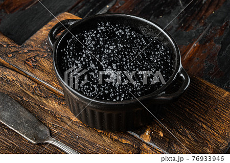Black Caviar, on old dark wooden table background Black Caviar, on old dark wooden table background 76933946