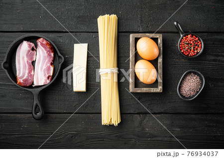 Carbonara pasta ingredients, on black wooden background, top view flat lay, with copy space for text Carbonara pasta ingredients, on black wooden background, top view flat lay, with copy space for text 76934037
