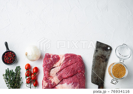 Raw piece of marble beef brisket,with ingredients for smoking making barbecue, pastrami, cure, on white stone background, top view flat lay, with copy space for text 76934116