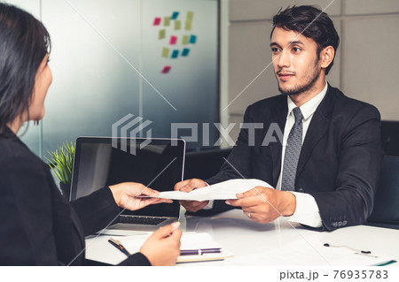 Human resource manager interviewing the candidate. 76935783