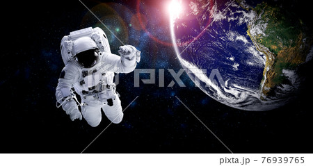 Astronaut spaceman do spacewalk while working for space station 76939765