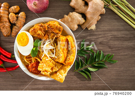 Curry Laksa which is a popular traditional hot and spicy noodle soup from the culture in Malaysia. 76940200