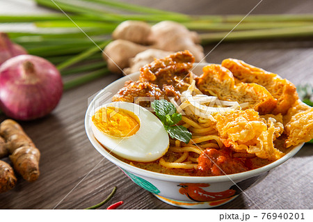 Curry Laksa which is a popular traditional hot and spicy noodle soup from the culture in Malaysia. Curry Laksa which is a popular traditional hot and spicy noodle soup from the culture in Malaysia. 76940201