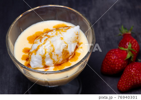 Snowy eggs and custard recipe on black background 76940301