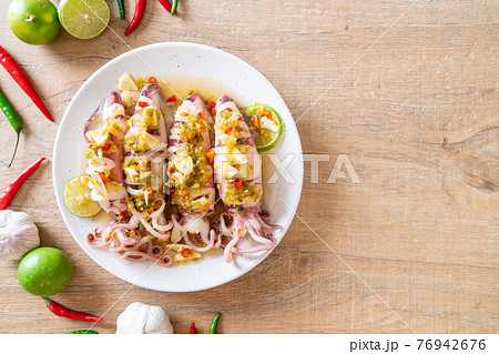 Steamed Squids with Spicy Chili and Lemon Sauce Steamed Squids with Spicy Chili and Lemon Sauce 76942676