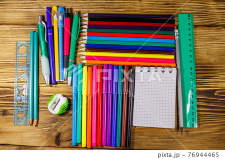 Set of school stationery supplies on a wooden desk. Back to school concept Set of school stationery supplies on a wooden desk. Back to school concept 76944465