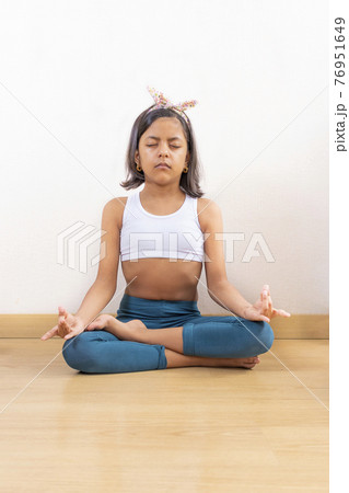 Teen girl doing yoga at home Teen girl doing yoga at home 76951649