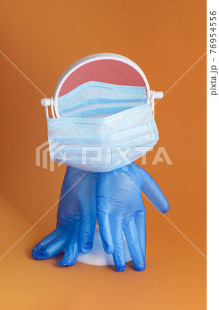 Medical gloves and mask on mirror 76954556