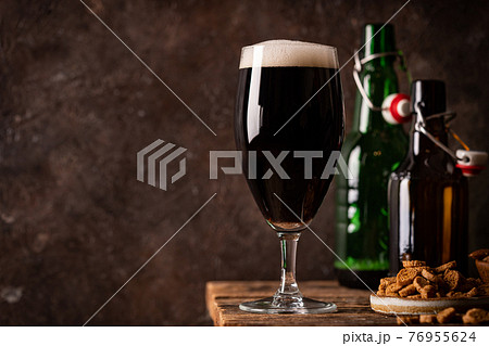 Glass of dark beer Glass of dark beer 76955624