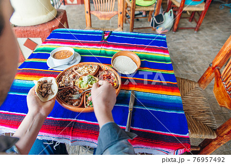 mexican plate with different meat and guacamole. 76957492