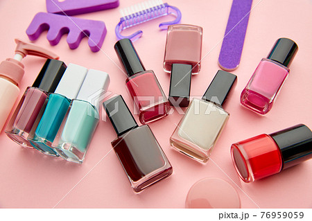 Nail care products, polish on pink background Nail care products, polish on pink background 76959059