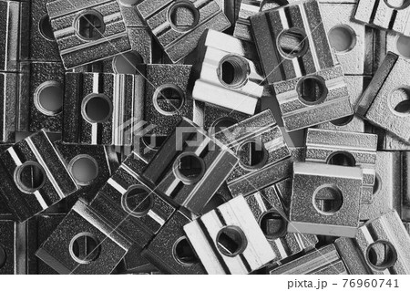slide screw nuts heap, closeup view slide screw nuts heap, closeup view 76960741