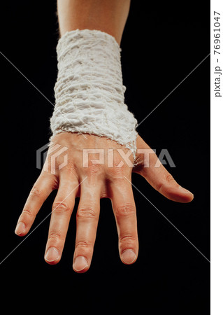 wrist wrapped with healing bandage wrist wrapped with healing bandage 76961047