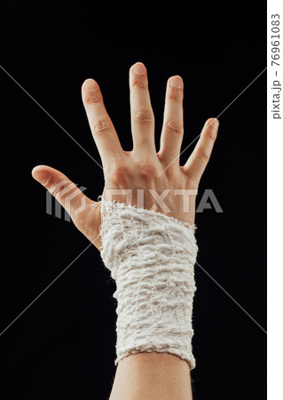 wrist wrapped with healing bandage wrist wrapped with healing bandage 76961083