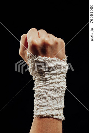 wrist wrapped with healing bandage 76961086