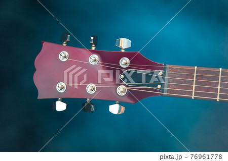 electric guitar head, blue background electric guitar head, blue background 76961778
