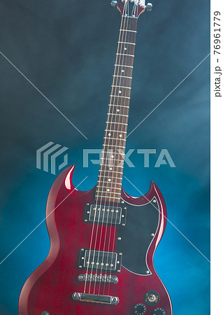 electric guitar in smoke, blue background 76961779