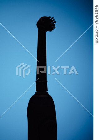 electric toothbrush silhouette, blue background electric toothbrush silhouette, blue background 76961846