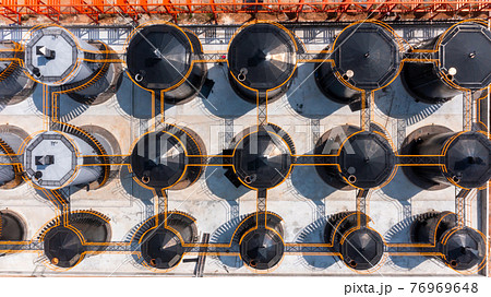 Aerial view oil and gas storage tank for petroleum products at the refinery business company, Industrial tanks for petrol and oil. Aerial view oil and gas storage tank for petroleum products at the refinery business company, Industrial tanks for petrol and oil. 76969648