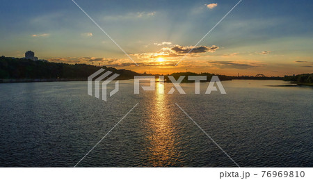 Sunset on the Dnieper river in Kyiv, Ukraine 76969810