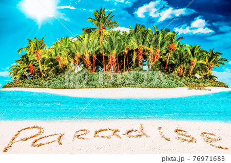 Whole tropical island within atoll in tropical Ocean and inscription "Paradise" in the sand on a tropical island. 76971683