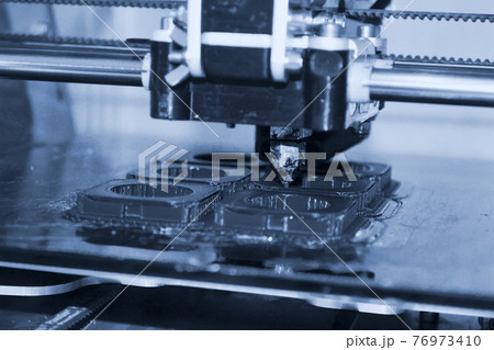 Modern 3D printer printing figure close-up. Automatic three dimensional Modern 3D printer printing figure close-up. Automatic three dimensional 76973410