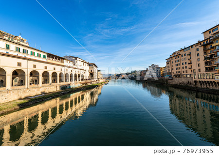 Arno River with the Vasari Corridor or Corridoio Vasariano - Florence Tuscany Italy 76973955