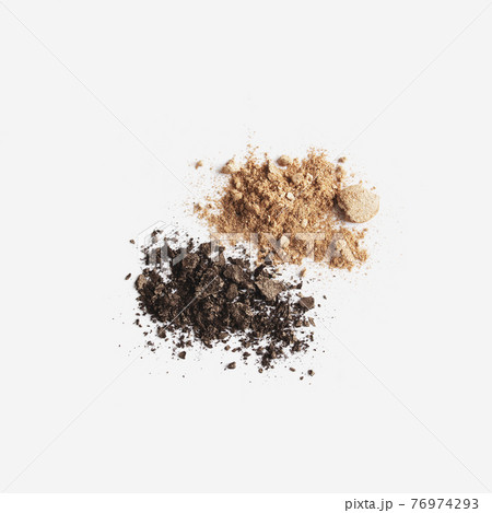 Isolated light and dark brown face or eye shadow on white background 76974293