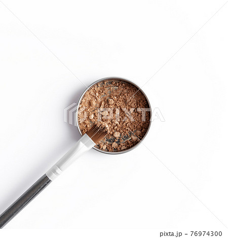Light brown face shadow in container and eye shadow or make-up brush 76974300