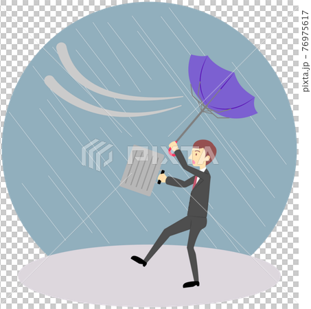 風に飛ばされそうなオフィスワーカー（男性） 76975617