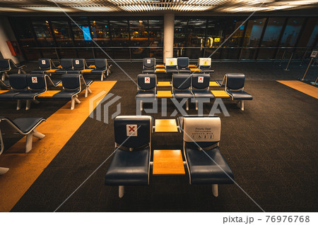 Seats and signs in the airport 76976768