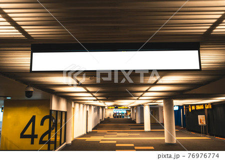 Seats and signs in the airport Seats and signs in the airport 76976774