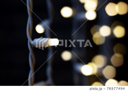 Lamp garland in the dark close up 76977494