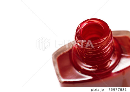 Jar with red nail polish, isolate, top view 76977681