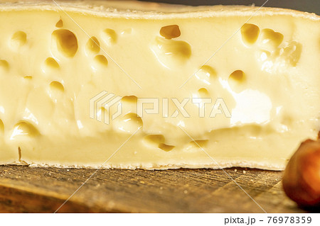 French cheese Saint Nectaire rustic collection delicious. Soft focus 76978359