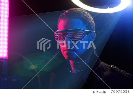 Cyberpunk style portrait of man in futuristic costume. 76979038