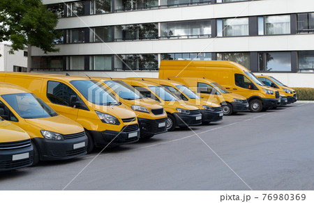 Yellow delivery vans  76980369