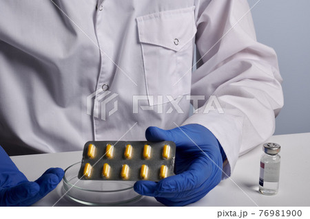 Doctor Shows Yellow Pills Blister 76981900