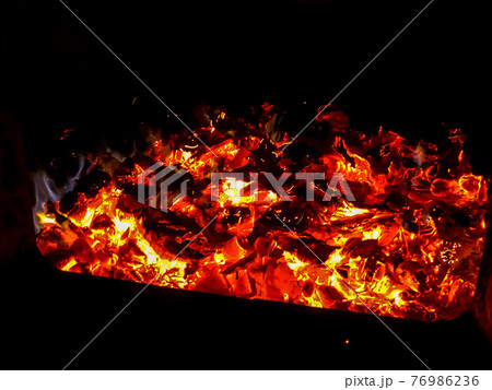 Fire place. Firebox with woodedn sticks. 76986236