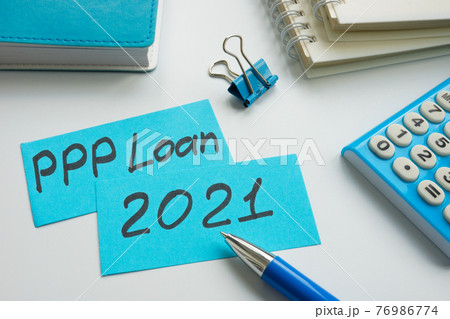 PPP loan 2021 words on the blue memo sticks. 76986774
