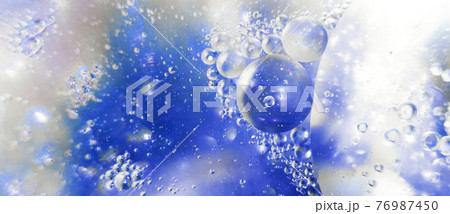 Oil bubbles close up. circles of water macro. abstract light blue background. banner Oil bubbles close up. circles of water macro. abstract light blue background. banner 76987450